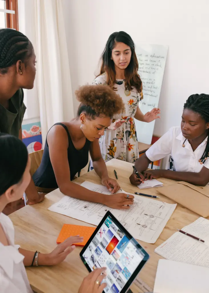 Group of people collaborating on an eco-friendly tote bag case study.