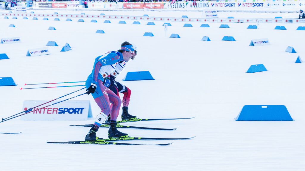 Cross-country skiers compete in a World Cup race, marking the post-ban era of fluoro ski wax.