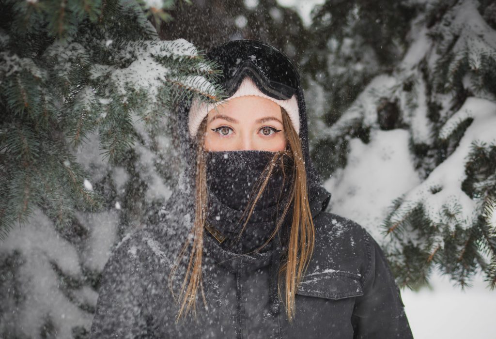 Cross-country skier demonstrates layering technique for optimal warmth and flexibility in varying weather conditions